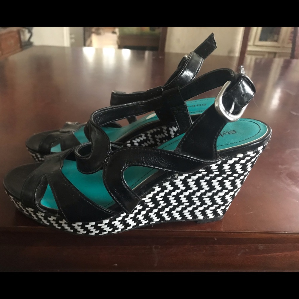 Brand new scrappy black wedge heels never worn